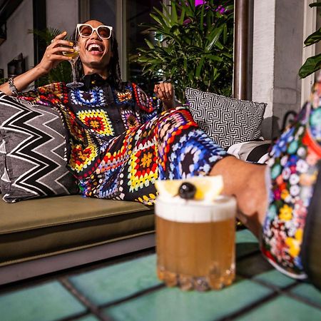 Qt Melbourne Hotel Ngoại thất bức ảnh A woman drinking a beer